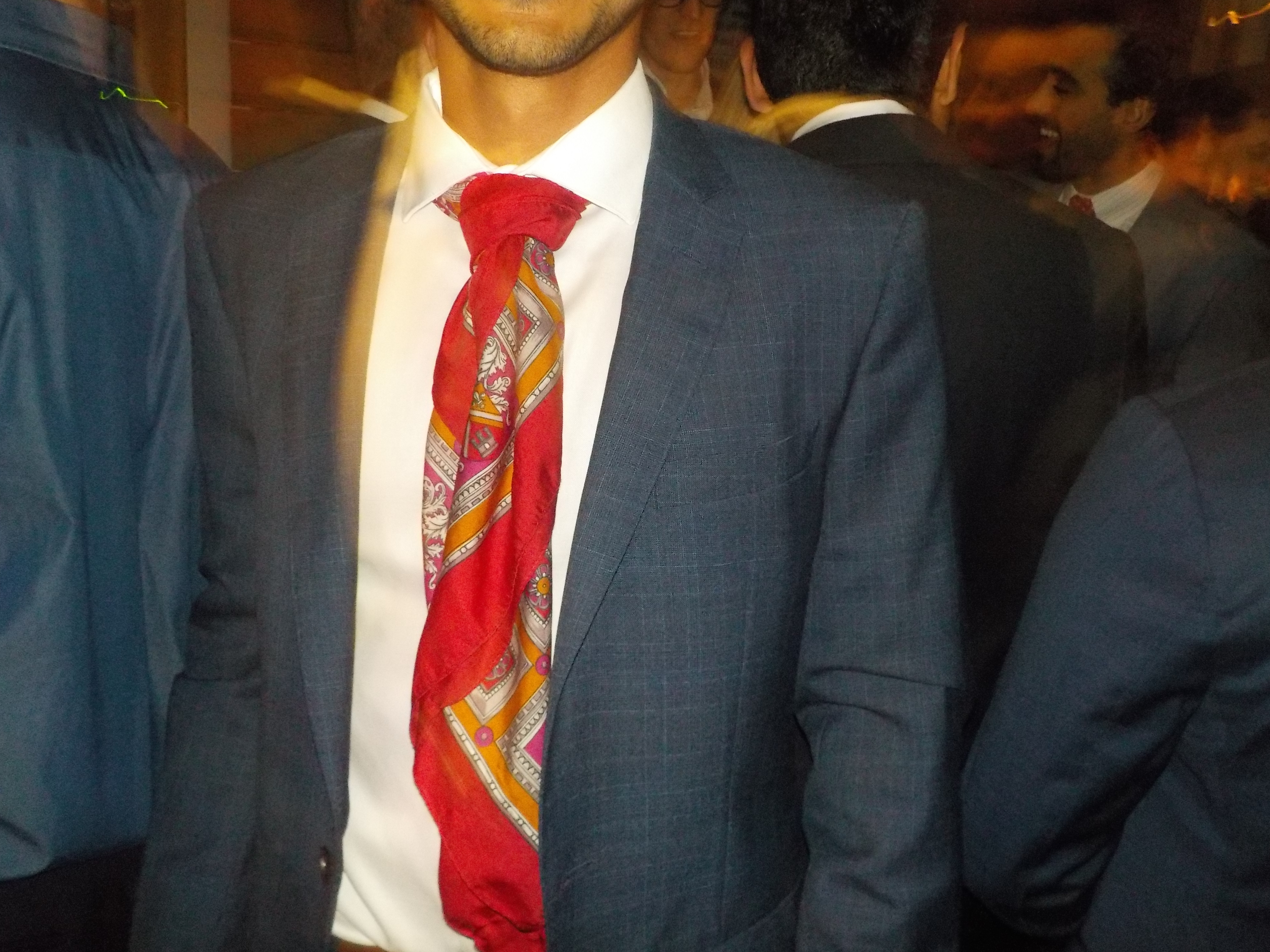 Statement Suit — Red silk scarf detail